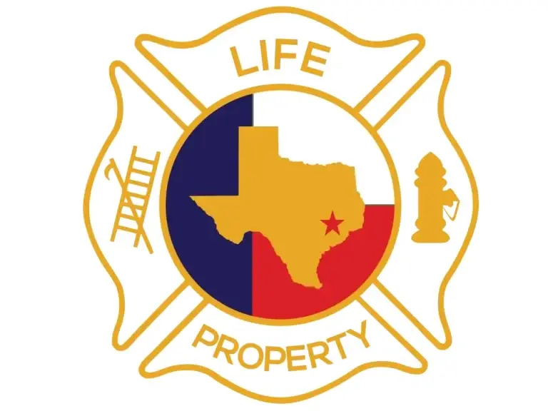 A firefighter emblem with a gold outline, featuring a Texas state shape over a red, blue, and yellow background. The words "LIFE" and "PROPERTY" are written, along with a fire hydrant and ladder symbols.